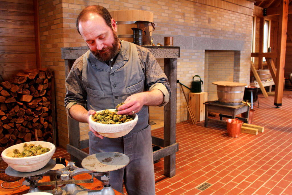 Rob Novak checking ingredients at OWW brewhouse test photoshoot.