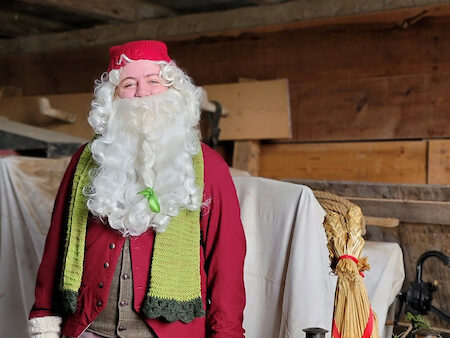 Person dressed as Santa smiling